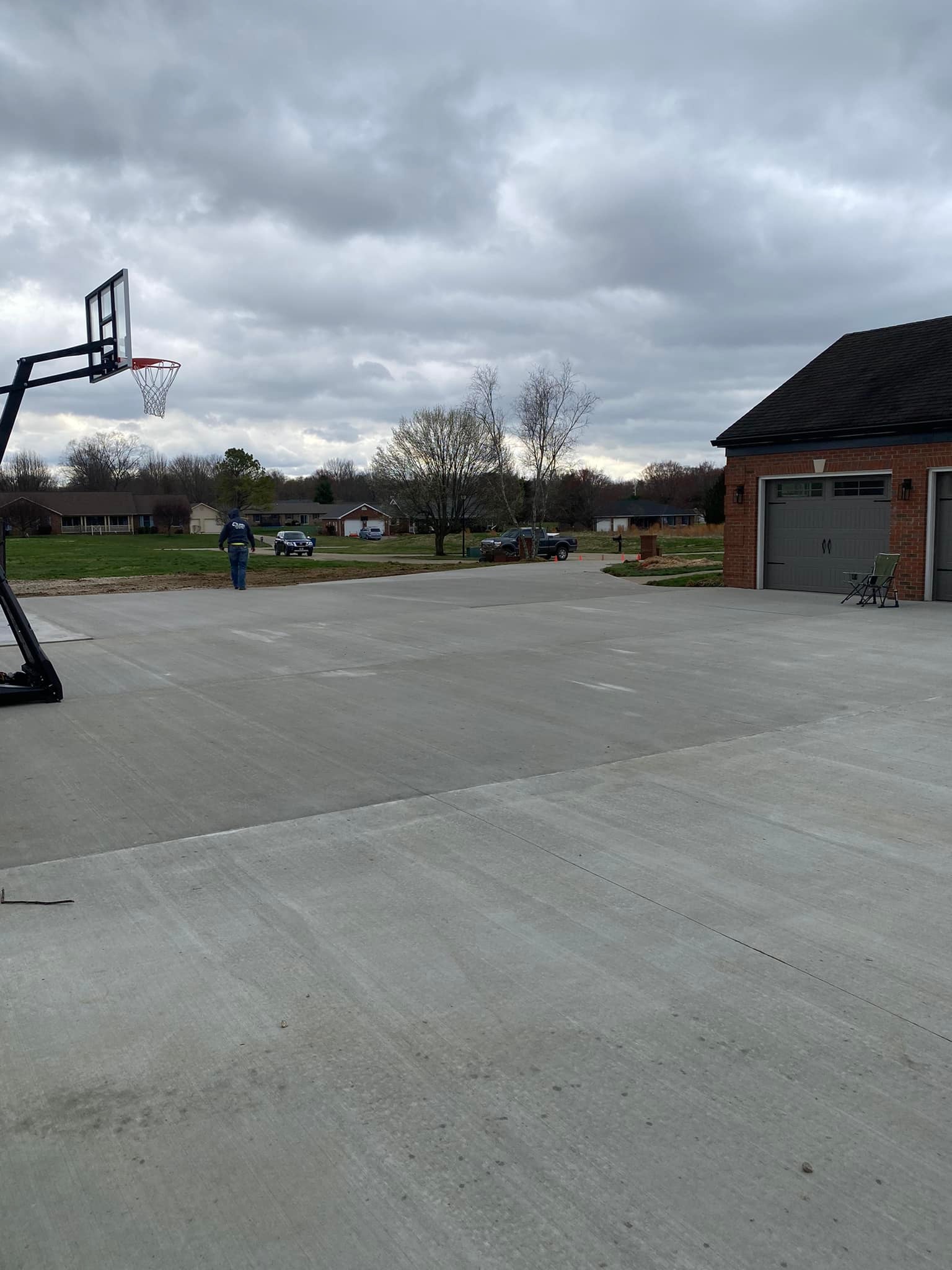 Concrete driveway with basketball hoop